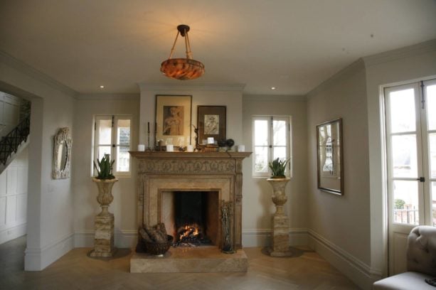 marble mid-century modern fireplace with golden-colored mantel