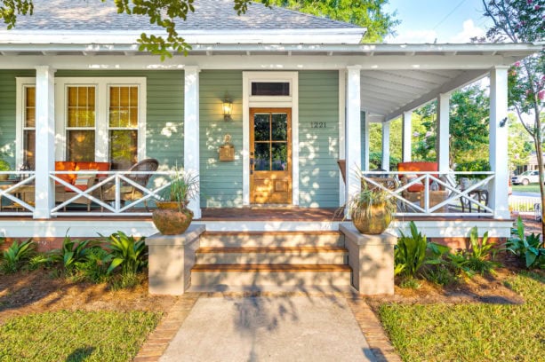 cumaru wood covers the concrete steps in a large front porch