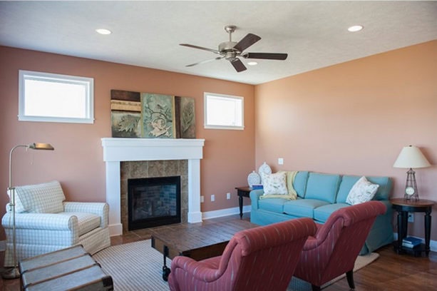 orange starfish wall color in an enclosed living room with a tiffany blue sofa