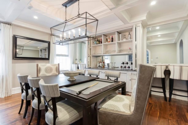 trendy dining room with billiard and a dry bar