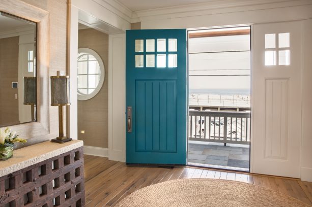 combination of the teal front door and beige walls