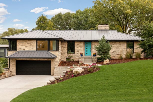 modern front exterior with the bright teal front door