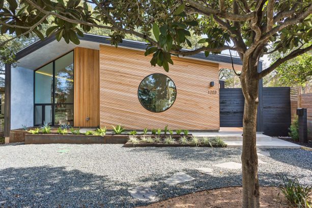 black flat roof with natural wood color wall in a modern house