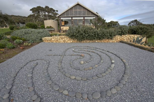 asian rock garden with pea gravel and mexican beach pebbles creating a labyrinth without plants