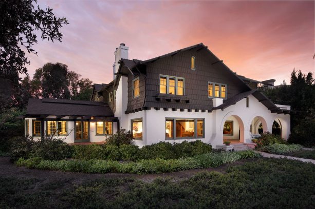 clean lines traditional green window trim paired with the black and white exterior color palette in a craftsman house