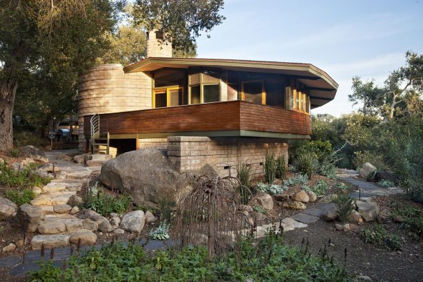 minimalist under deck landscaping with large boulders