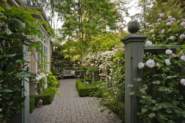 mediterranean style privacy side yard with a seating space