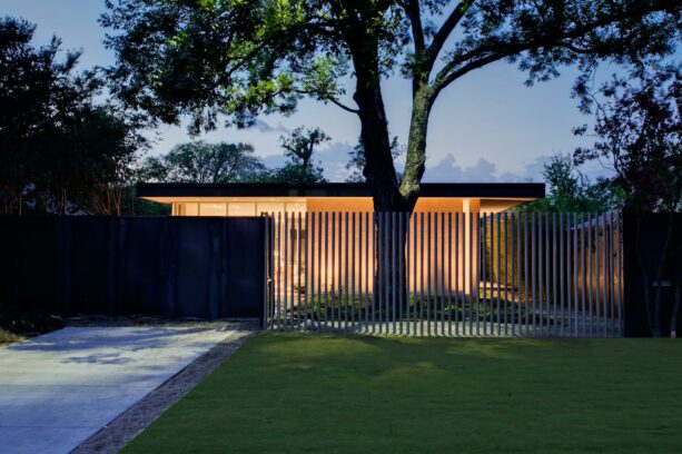 combination of steel screen and metal posts as a mid-century modern fence