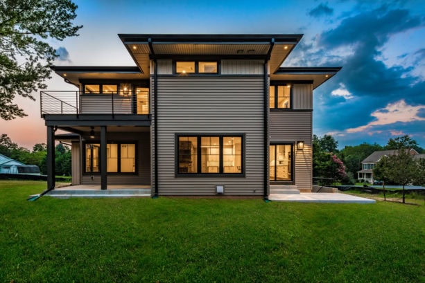 new contemporary ranch style vinyl siding exterior with a shed roof