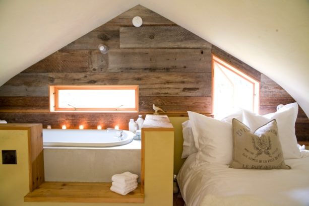 extra bedroom in the attic with slanted ceilings and walls with no fireplace