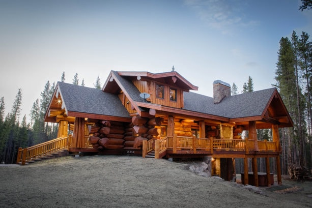 natural oak color stain log cabin exterior with pine siding