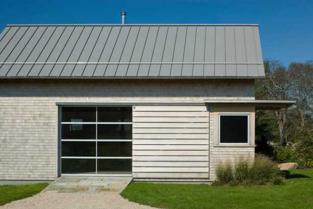 combination of metal, glass and wood side sliding garage doors