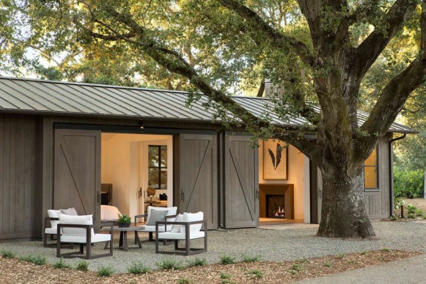 lift and slide steel exterior barn doors for a farmhouse patio design