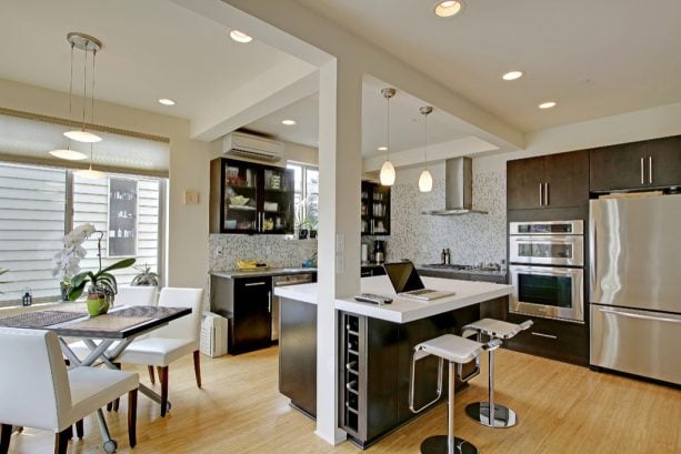 setting a kitchen island around the decorative support beam