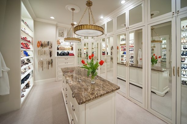 double pendant 5-light with aged brass lighting in a crisp white walk-in closet