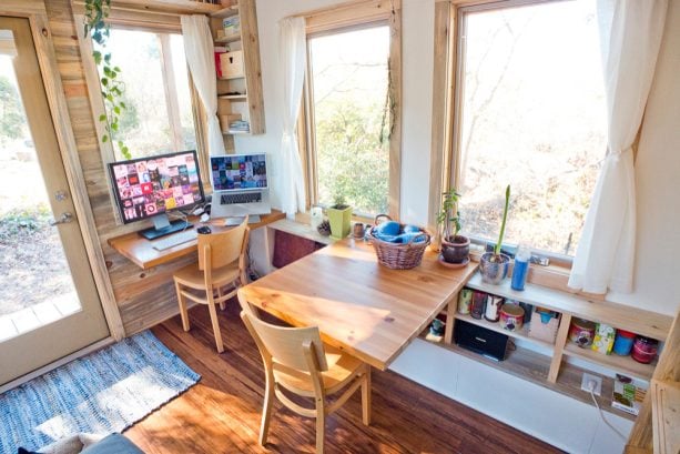 square shaped dining table that is also served as a single desk in a small home office dining table