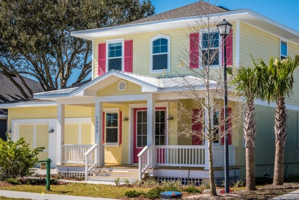 bright pink shutter color that goes with a yellow house