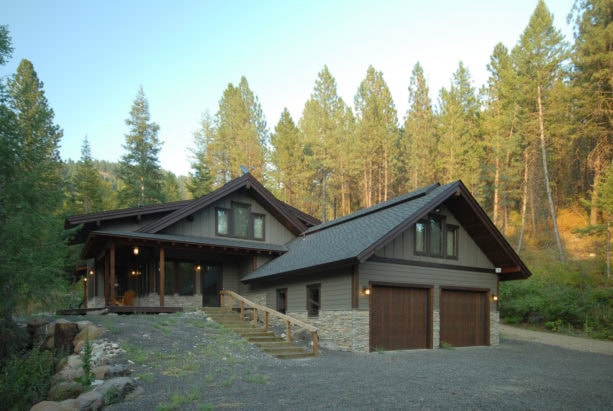 classic green-wood exterior house with chocolate brown trim