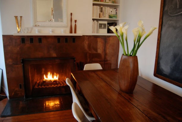 copper mid-century modern fireplace with crisp white mantel