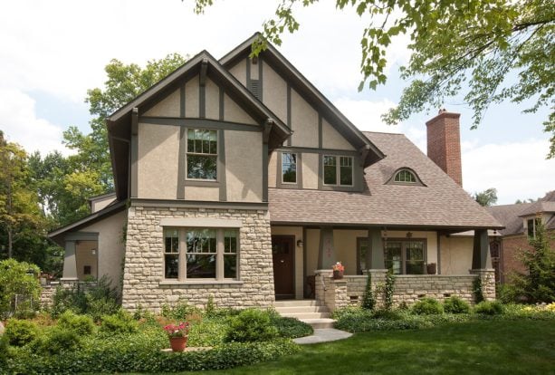 craftsman-style window long trims painted in sherwin williams - english ivy paired with natural stucco wall