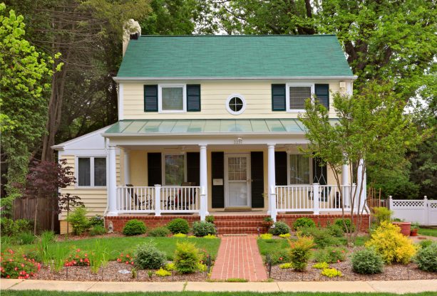 deep green shutter color that goes with a yellow house