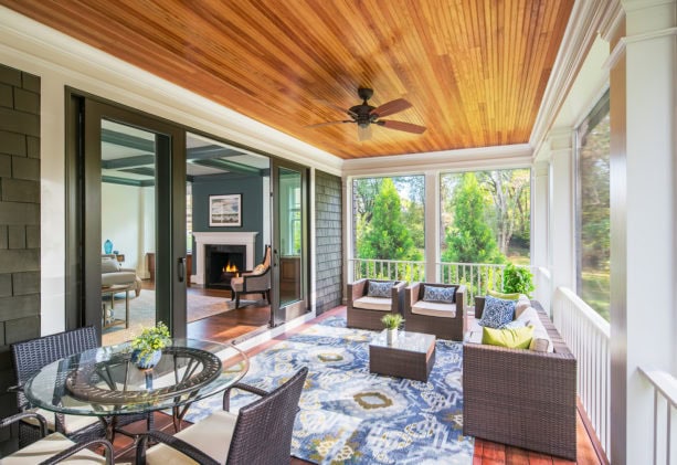 combination of wood ceiling, railing, and screen to enclose a porch for living space