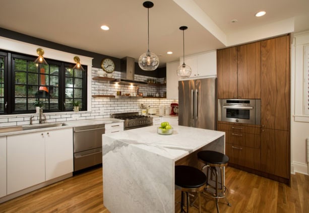 black painted pella picture windows over an undermount sink in an island kitchen