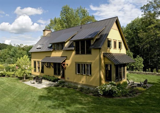 yellow and olive house color combination with metal roof