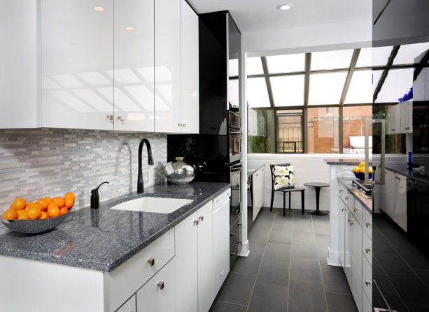 black porcelain tile with white grout kitchen floor to create a minimalist look