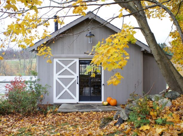 white and gray double x brace single sliding exterior barn door for a home office