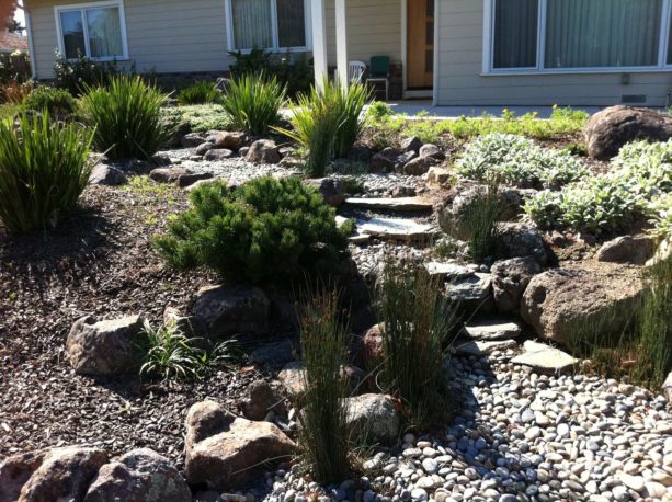 asian style desert backyard with full stone landscaping idea