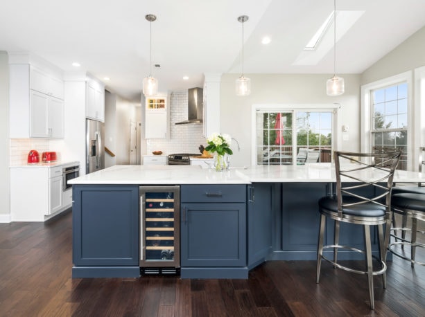 transitional kitchen with dark hardwood flooring and white quartz countertop