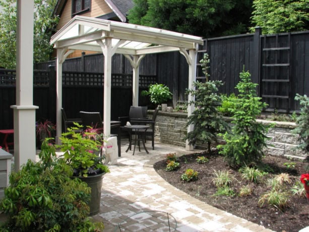 cozy small backyard with a covered concrete patio