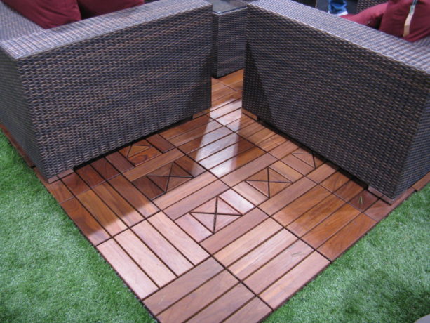 the use of interlocking composite deck tiles to create patio on grass