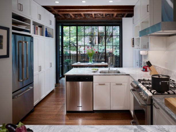 contemporary kitchen with floor-to-ceiling bay windows over a bar sink