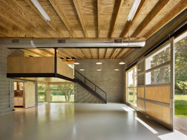 side sliding barn-track carriage door in a three-car garage