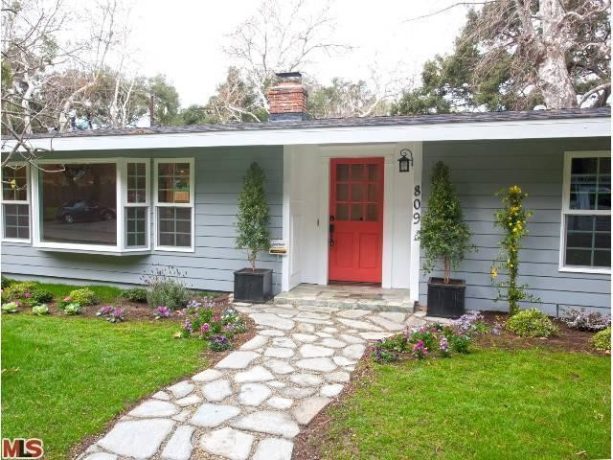 red coral front door paired with the light gray and white color scheme