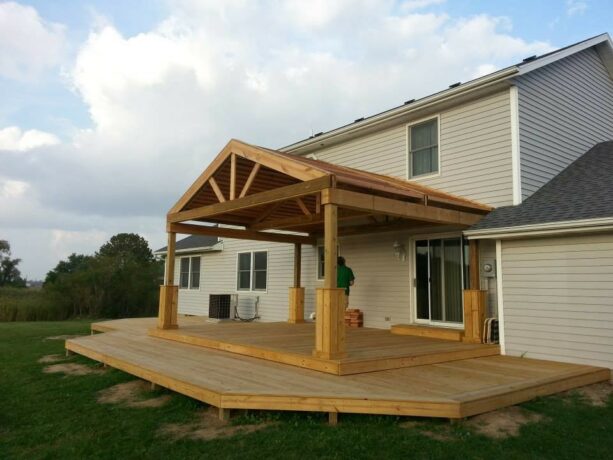 craftsman-style small back porch surrounded by decking