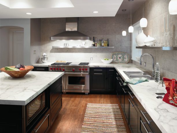 dark kitchen cabinets with light laminate countertops balanced by the gray backsplash