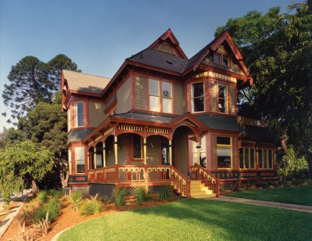 queen anne victorian pale green house with caramel brown trim