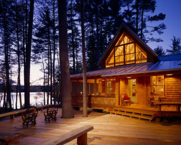 elevated decking log cabin porch connected to the patio