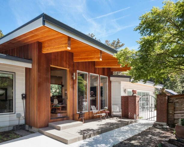 a modern small back porch is made of concrete