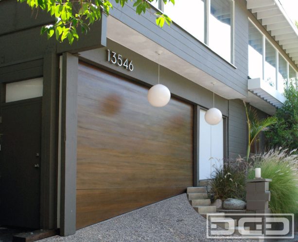 uneven garage door with sloping bottom sections in a mid-century design