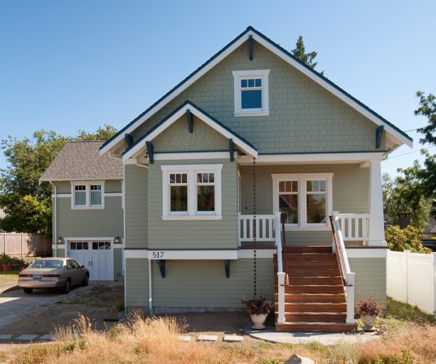 combination of benjamin moore - cloud nine exterior window trim with a crown molding and weekend getaway body paint color in a craftsman house