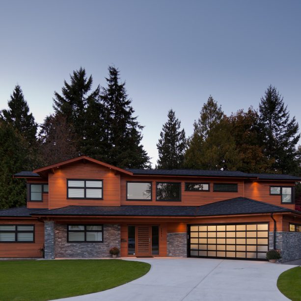 contemporary house with brown wall and a black roof