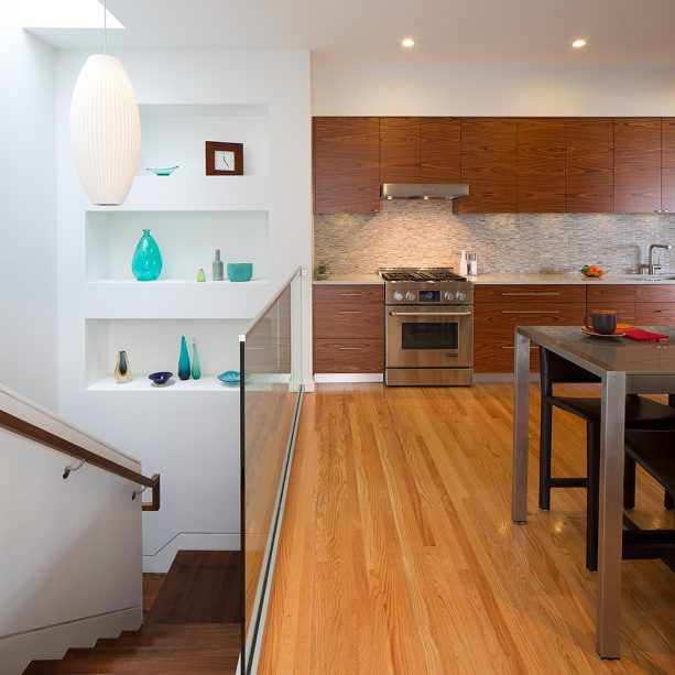 recessed wall niche in a landing of a staircase to show decorative dinnerware