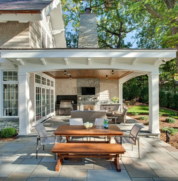 bluestone covered patio with bluestone veneer fireplace