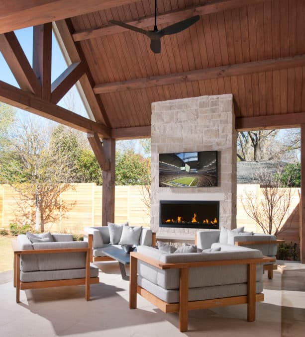 modern patio with outdoor gas fireplace and wall mounted tv