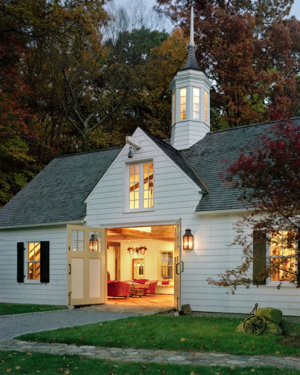 double glass panel barn door as the main entrance of a traditional exterior design house