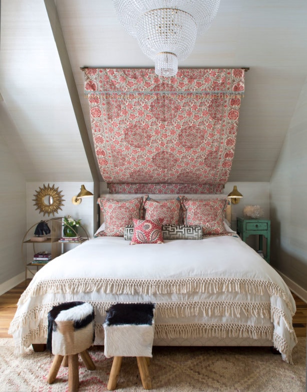 idea for a small yet stylish attic bedroom with light gray slanted walls